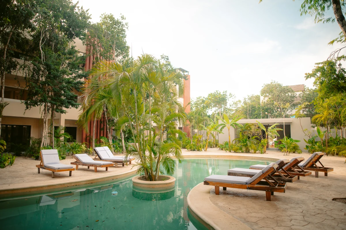 Image of Swimming Pool at AAK, featuring Resort Style Pool, Tropical Landscaping.