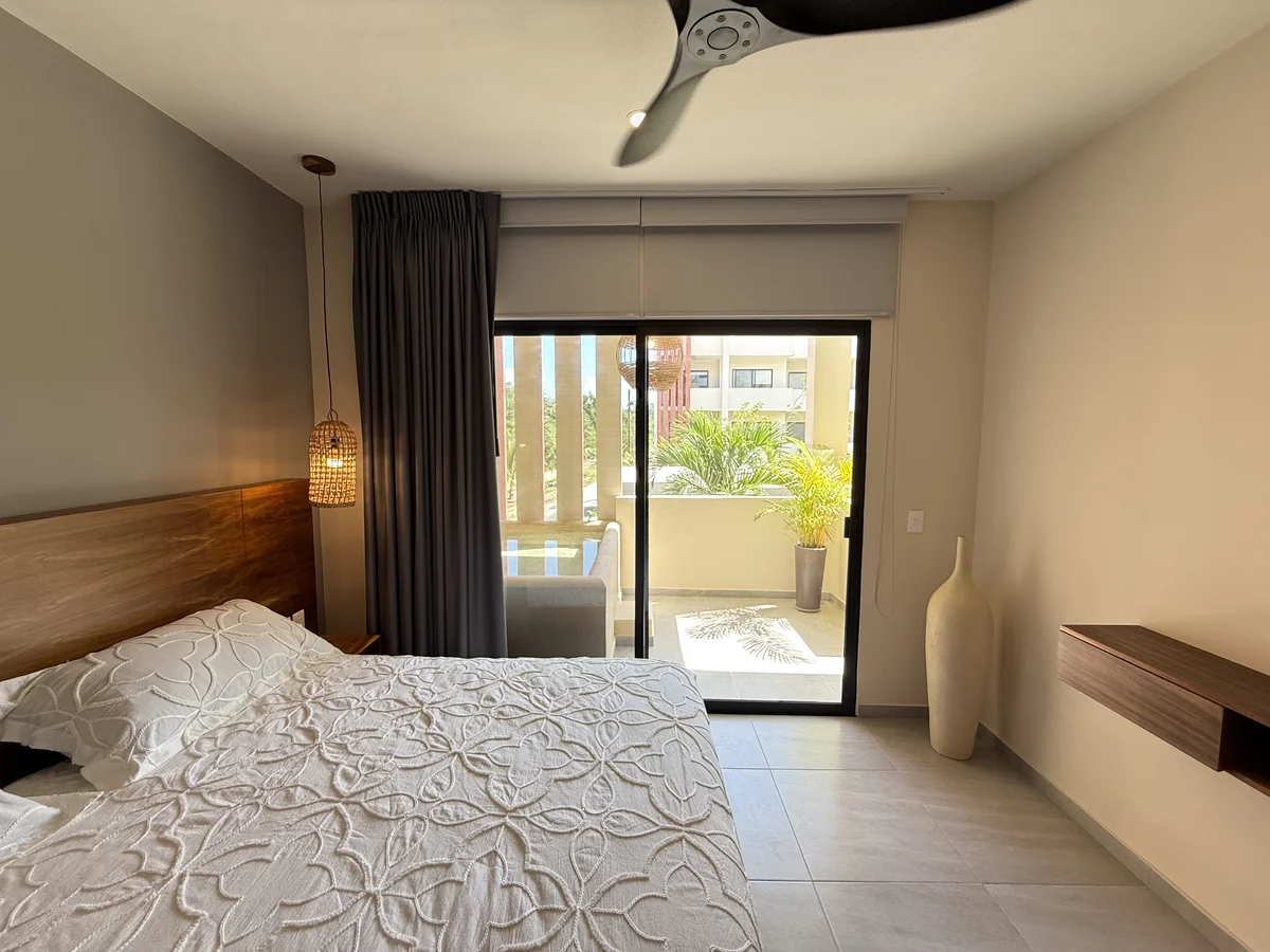 View of Bedroom at AAK, showcasing Modern Bedroom, Private Balcony.