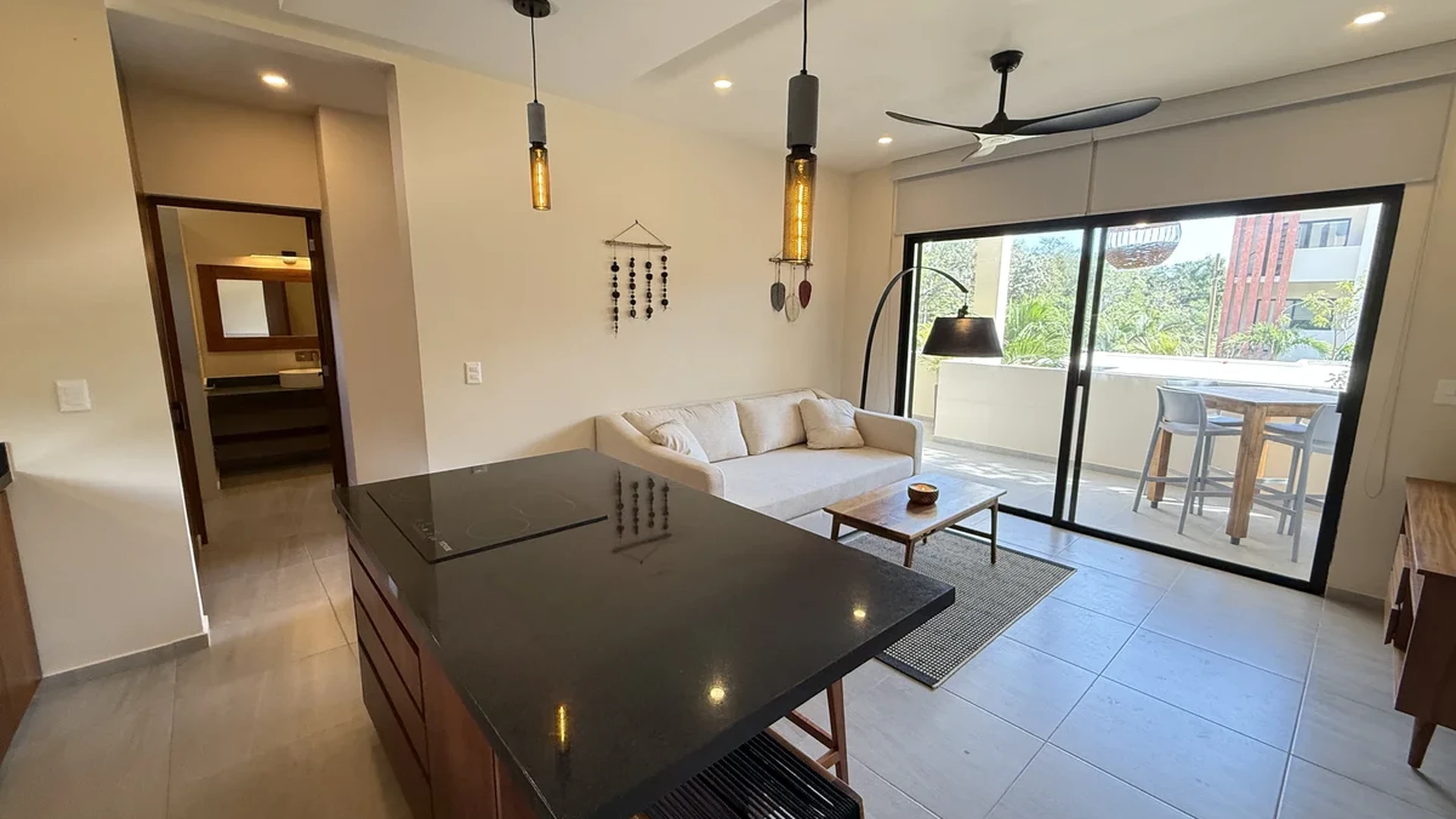 View of Open Concept Living at AAK, showcasing Modern Interior Design, Kitchen Island.