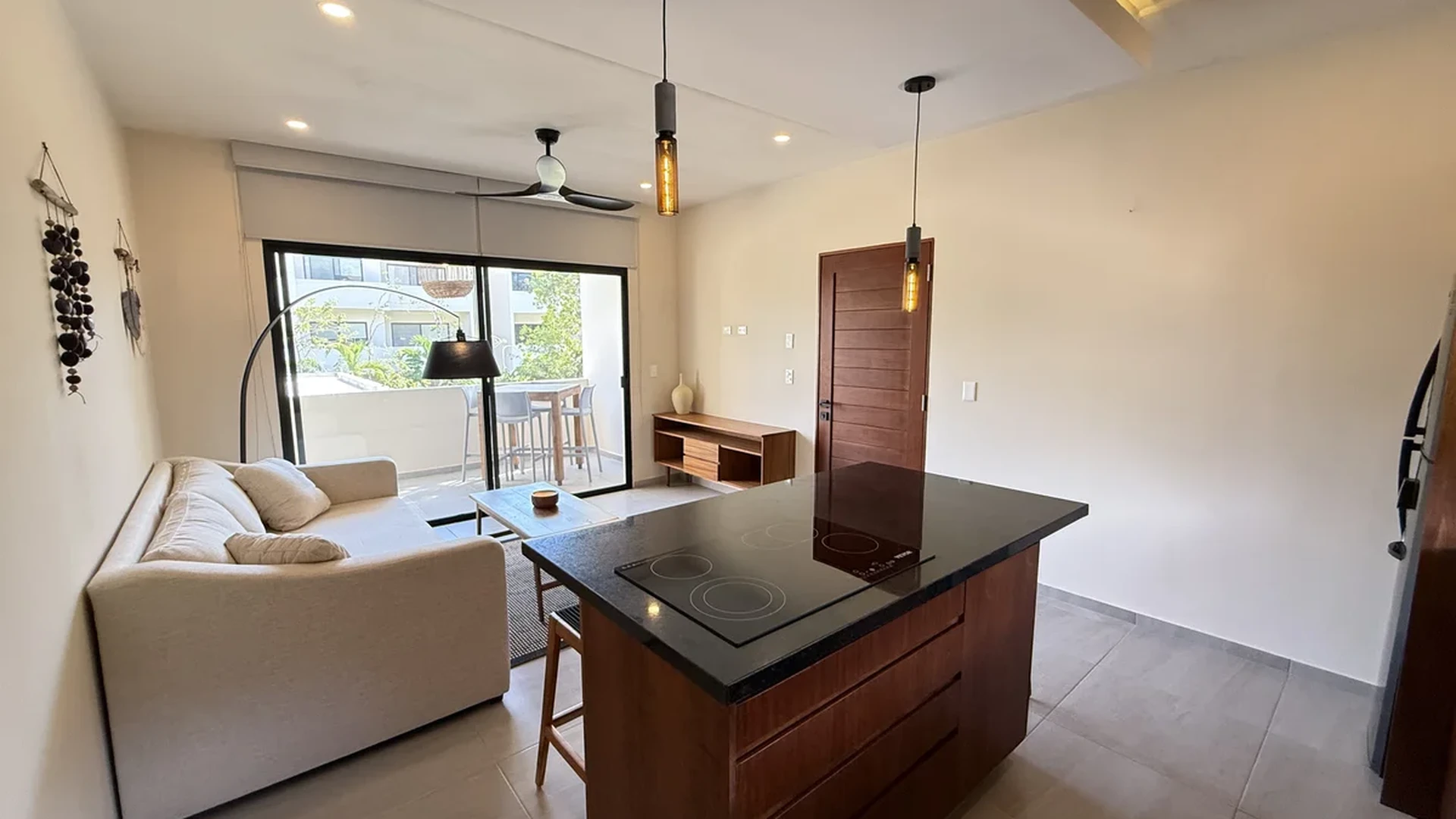 View of Open Concept Living at AAK, showcasing Modern Kitchen Island, Living Room.