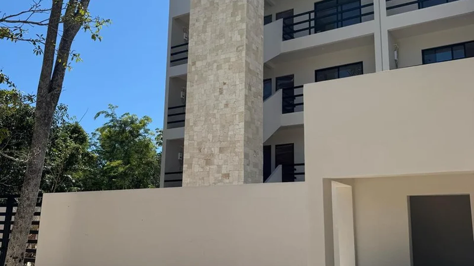 View of Modern Building Exterior at Zek Tulum, showcasing Residential Facade, Contemporary Architecture.