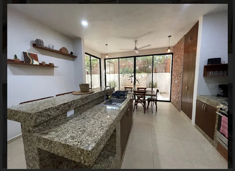 View of Modern Kitchen at Akasha Homes, showcasing Dining Area, Open Concept.