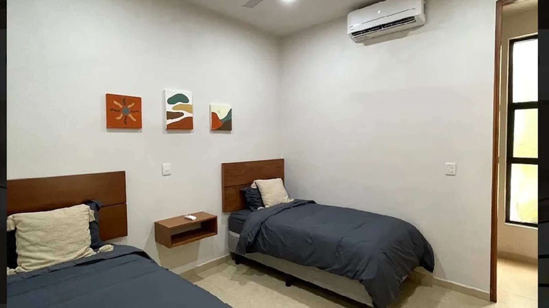 View of Bedroom at Akasha Homes, showcasing Twin Beds, Air Conditioning.