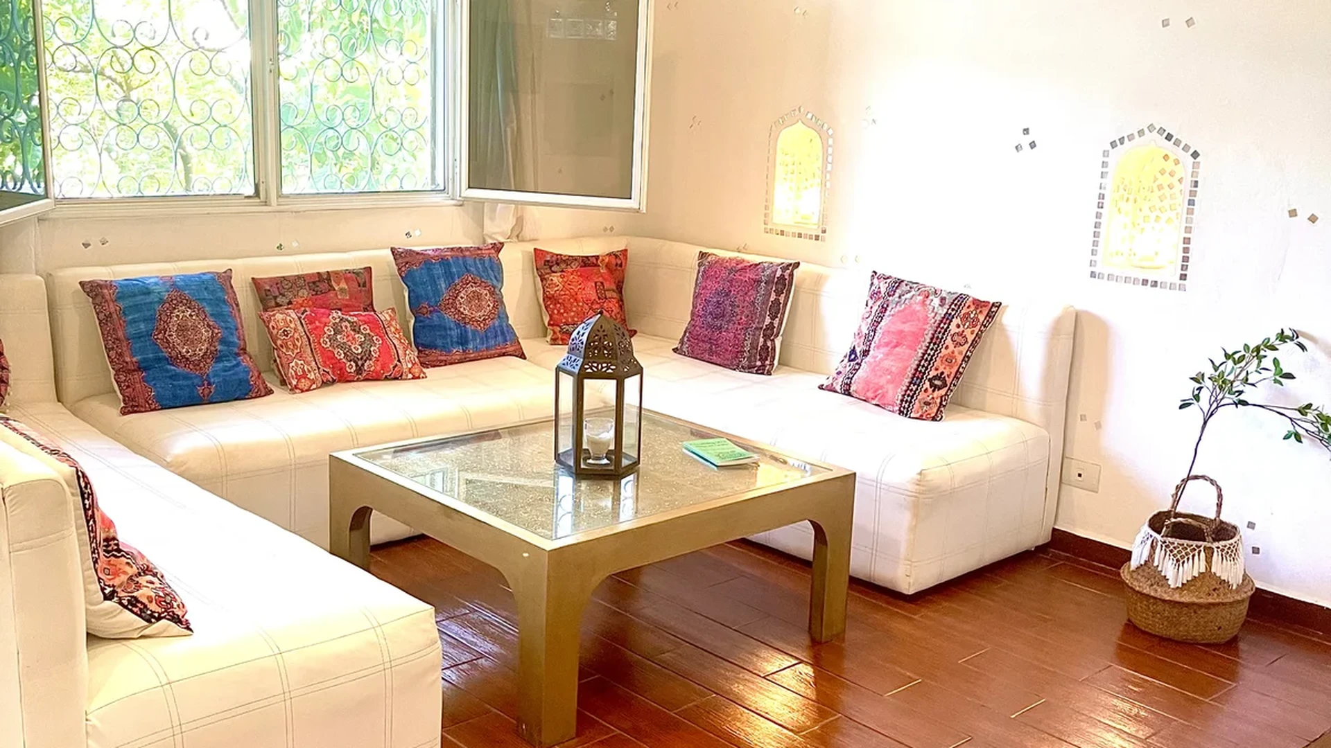 View of Living Room at Casa Dragonfly, showcasing Bohemian Decor, Moroccan Inspired.