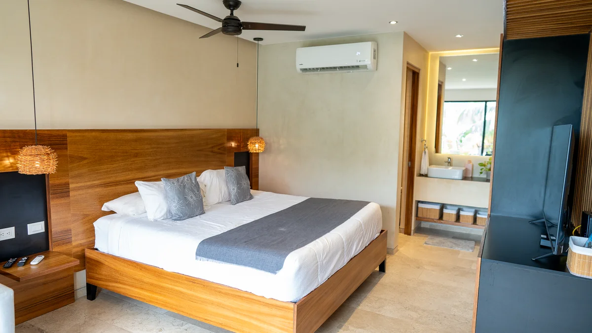 View of Modern Bedroom at Kaahal, showcasing King Size Bed, Wood Headboard.