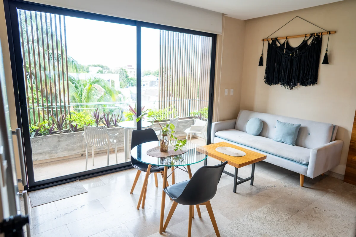 View of Modern Living Room at Kaahal, showcasing Dining Area, Private Balcony.