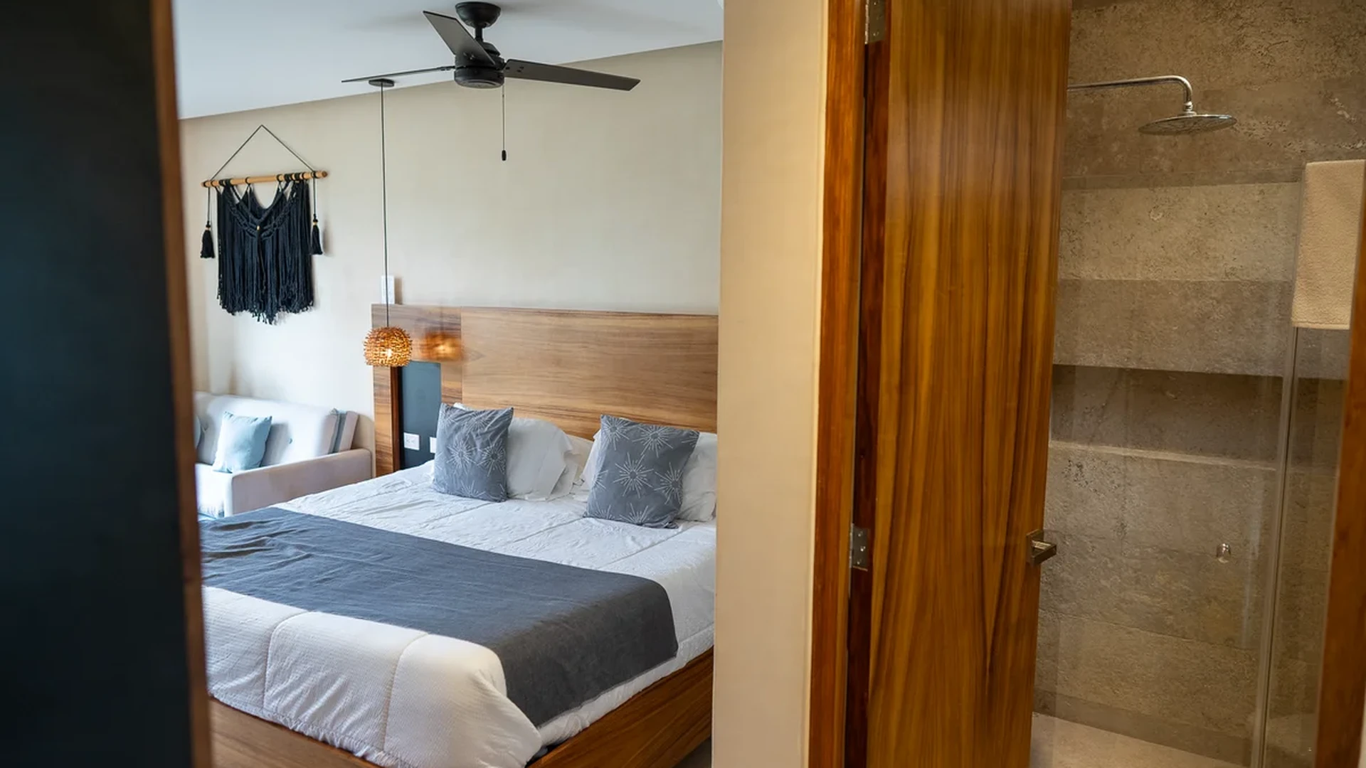 View of Modern Bedroom at Kaahal, showcasing King Bed, Stylish Decor.