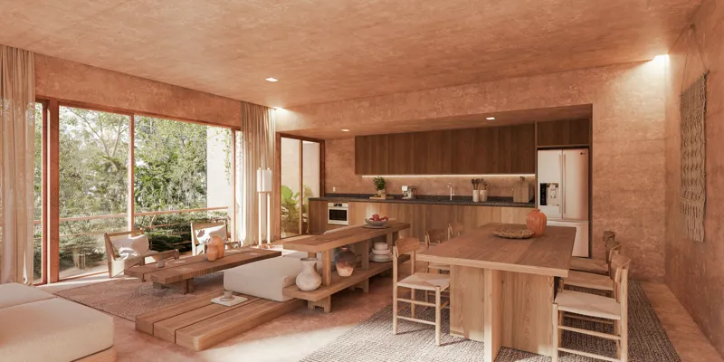 A warm, inviting render of a spacious living room and open-plan kitchen in an Aldea Kalan apartment, featuring natural wood tones, light-colored furniture, and large sliding glass doors opening to a lush green balcony, embodying the Wabi Sabi phil...