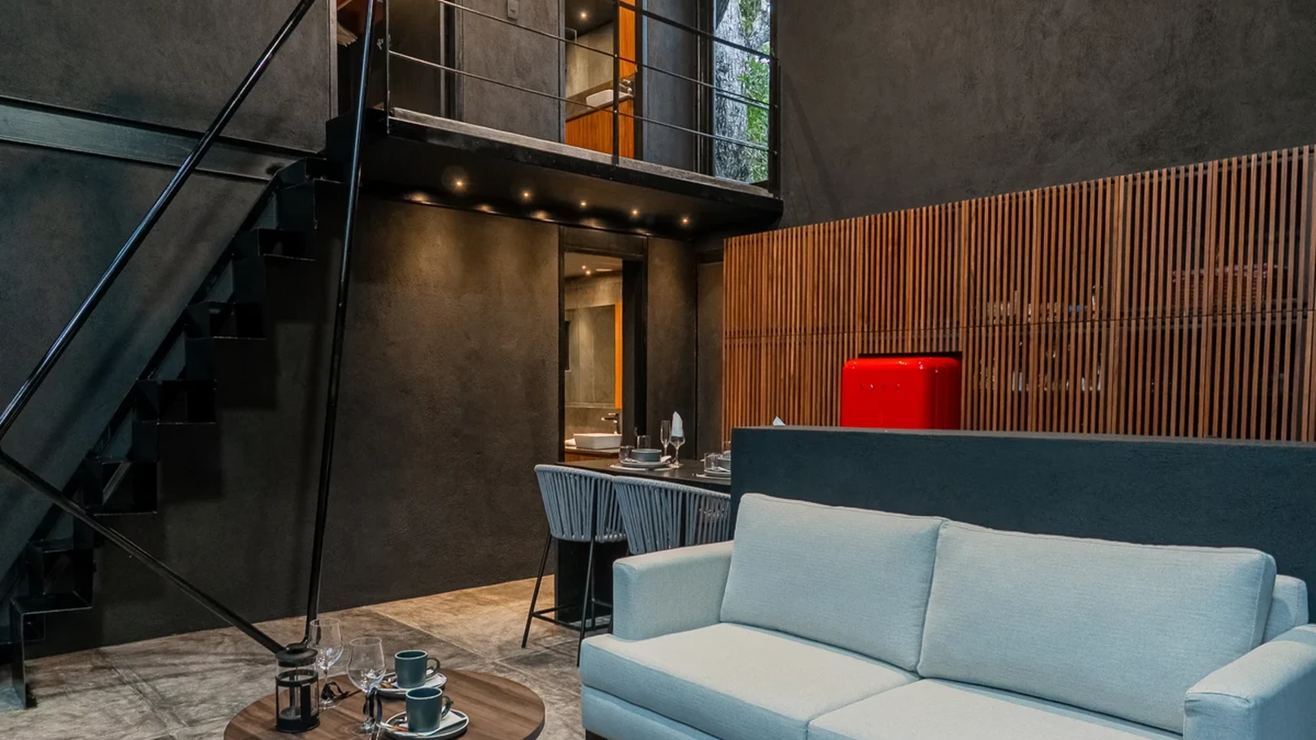 View of Modern Living Room at Tree60, showcasing Industrial Design, Loft Apartment.