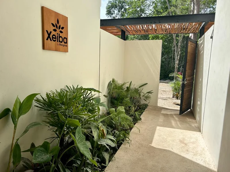 Image of Garden at Xeiba, featuring Tropical Entrance, Lush Landscaping.