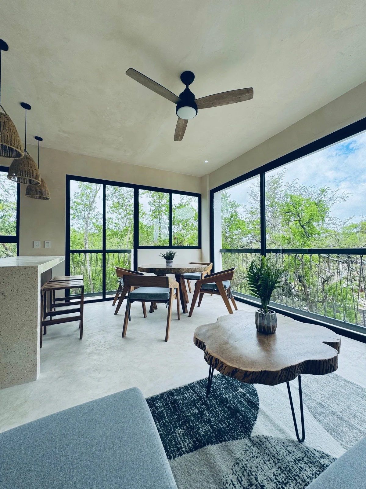 View of Modern Living Room at Xeiba, showcasing Open Concept, Panoramic Windows.