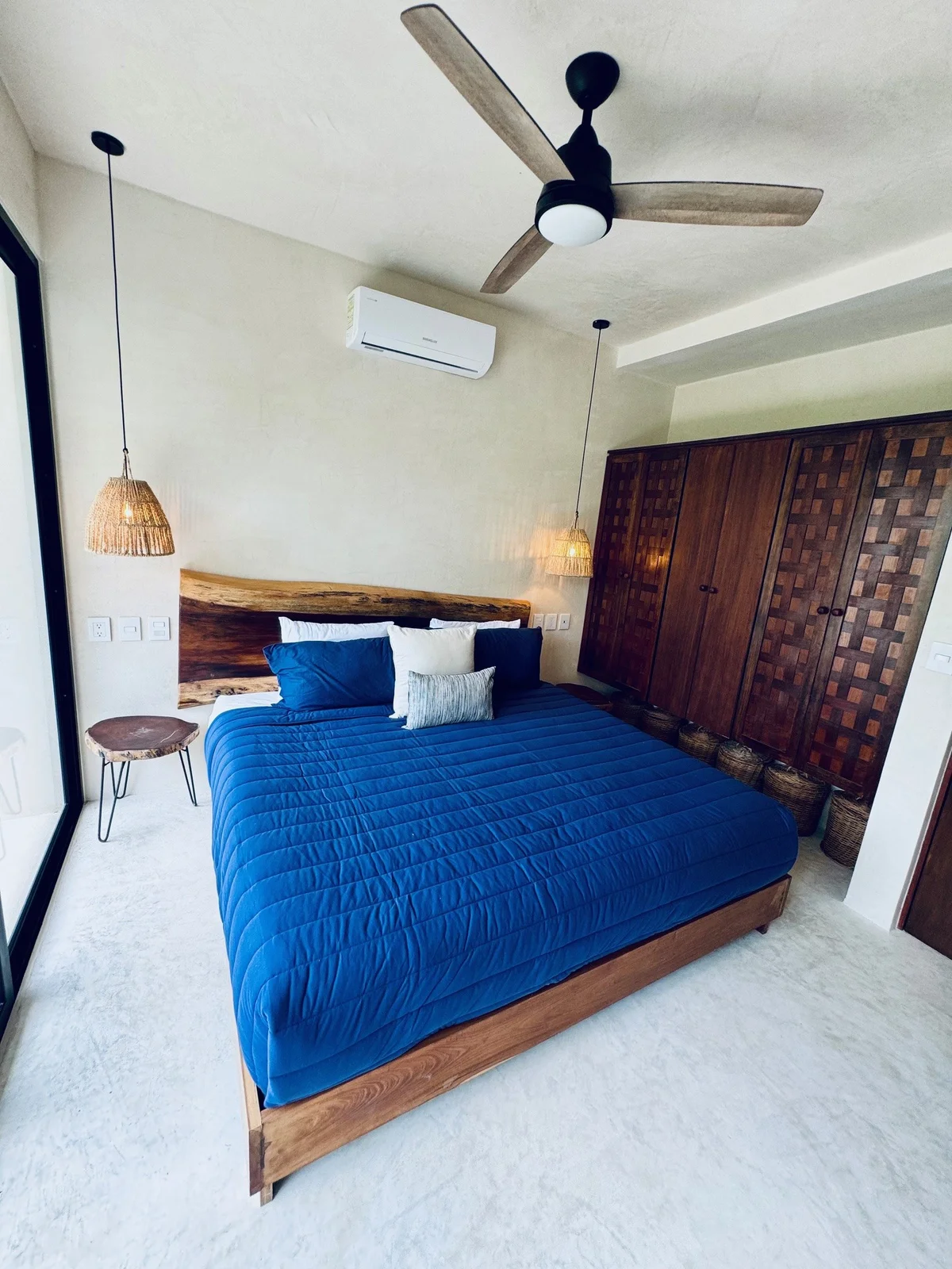 View of Modern Bedroom at Xeiba, showcasing King Size Bed, Wood Headboard.