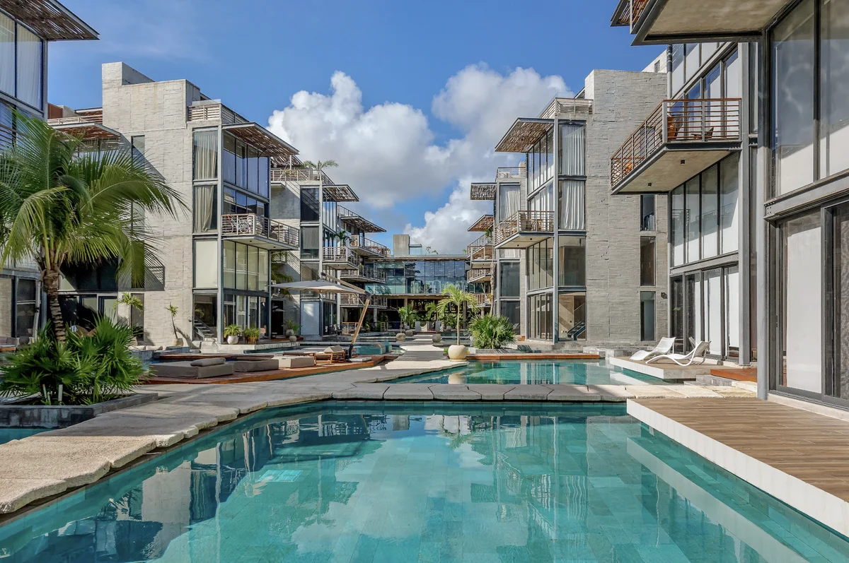 Image of Swimming Pool at Xalet, featuring Modern Architecture, Luxury Apartment Complex.
