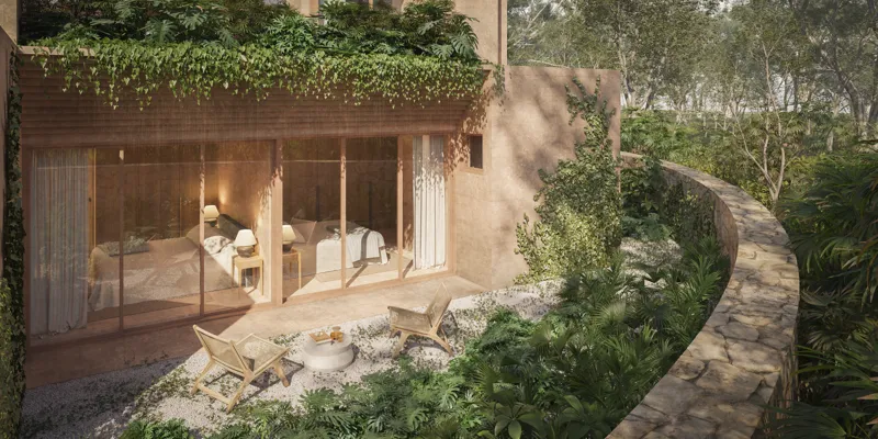 A high-angle render of a spacious outdoor rooftop terrace at Aldea Kalan, featuring a long wooden dining table with chairs, an integrated outdoor kitchen/bar area, and a wooden lounge chair on a light-colored patio, all under a clear blue sky with...