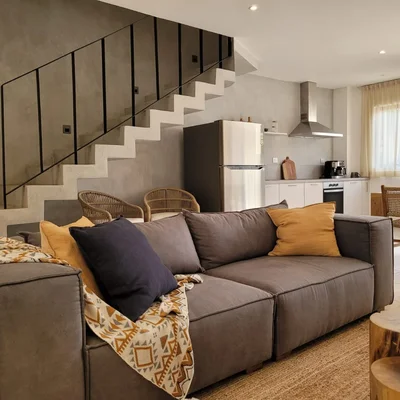 View of Open Concept Living at Fabula, showcasing Modern Interior Design, Sleek Kitchen.