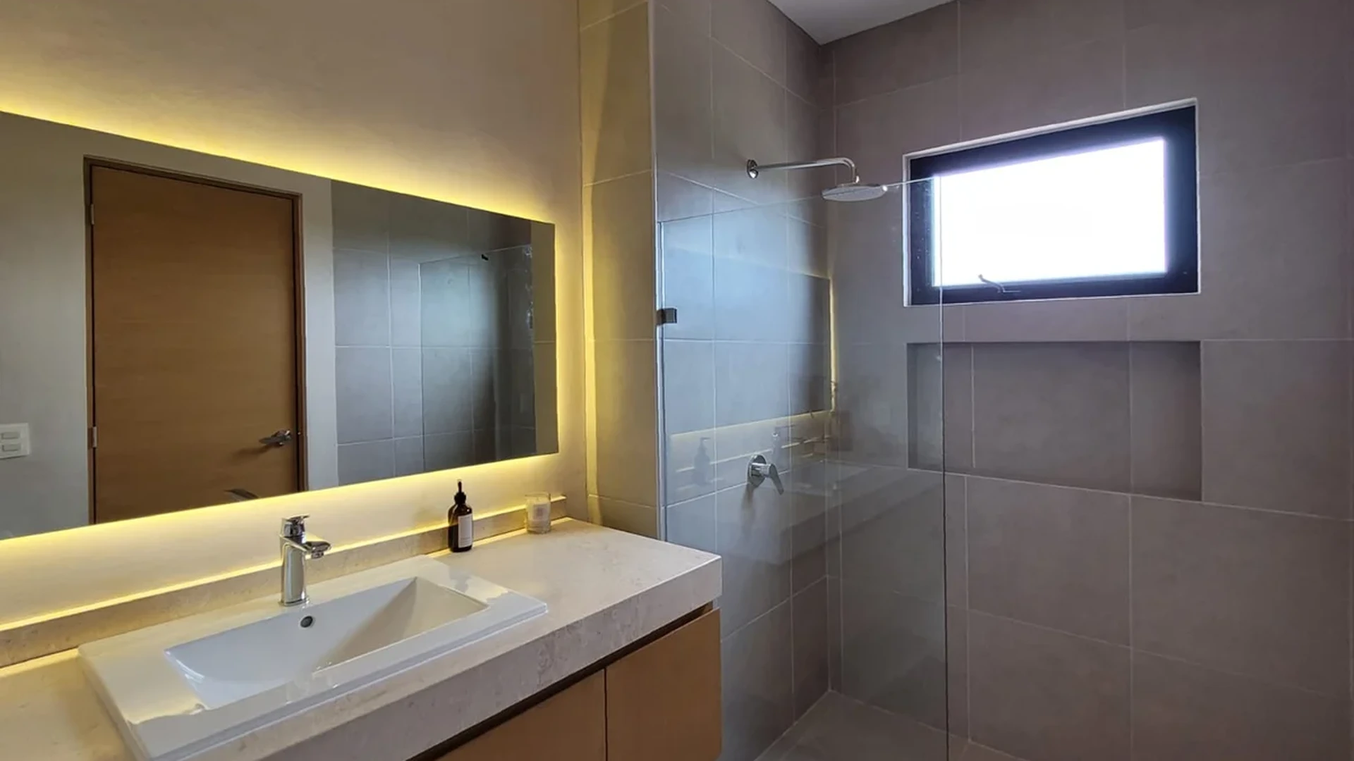 View of Modern Bathroom at Fabula, showcasing Contemporary Design, Walk-in Shower.