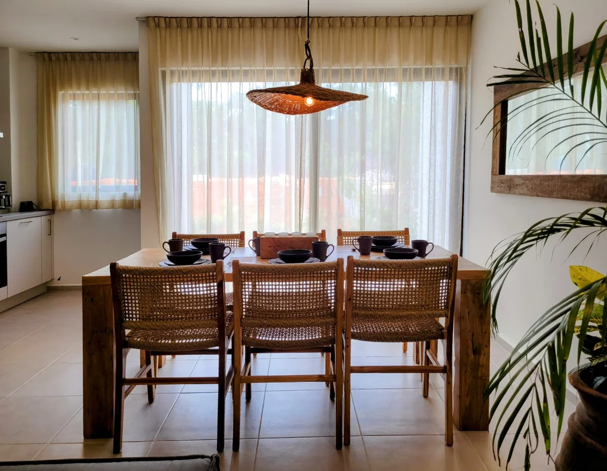 View of Dining Room at Fabula, showcasing Open Concept Living, Modern Coastal Style.