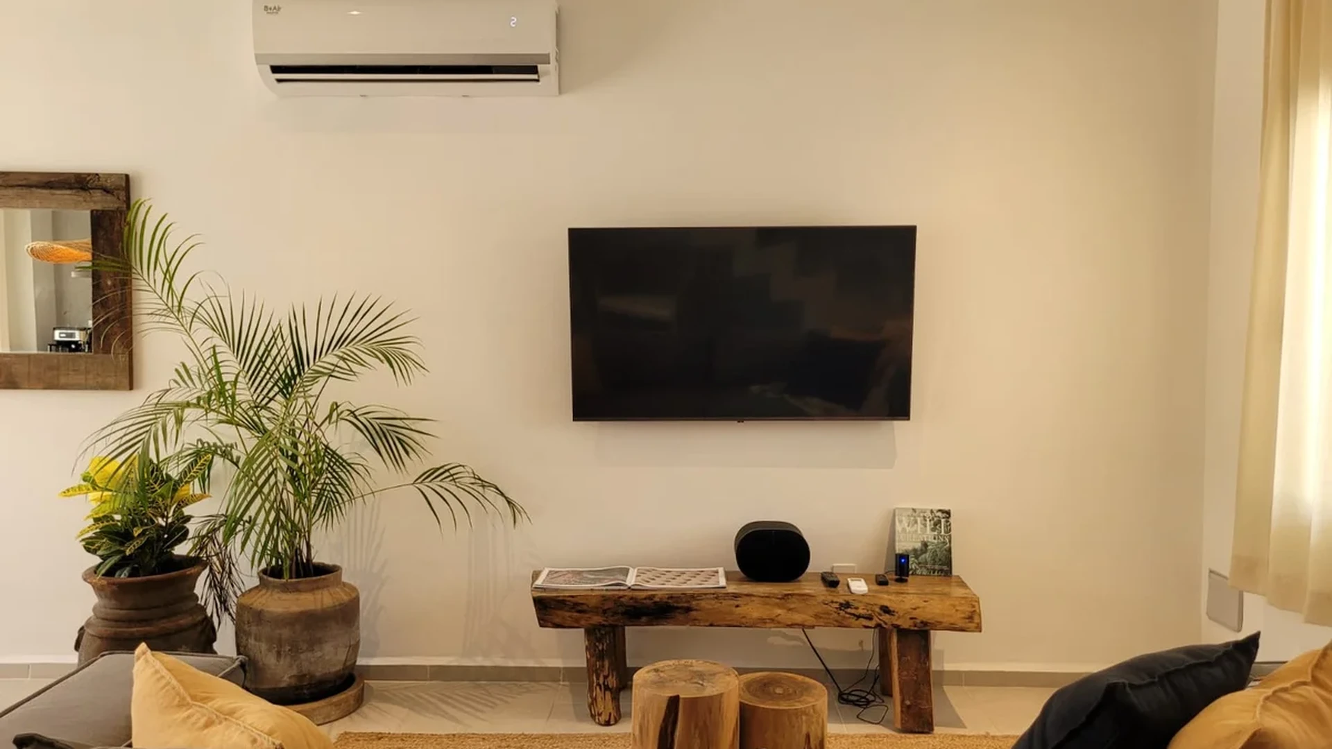 View of Living Room at Fabula, showcasing Modern Interior, Flat Screen TV.