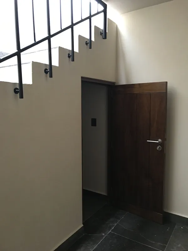 A series of eight photographs depicting the finished interiors and private rooftop amenities of a residential unit within the Humana development in Tulum. Images include a spacious living area with dark tiled floors and large glass doors, a modern...