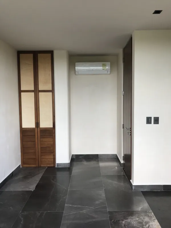 A series of eight photographs depicting the finished interiors and private rooftop amenities of a residential unit within the Humana development in Tulum. Images include a spacious living area with dark tiled floors and large glass doors, a modern...