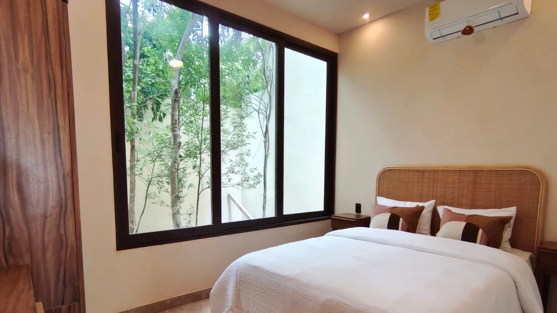 View of Bedroom at Uxmal, showcasing Modern Interior, Natural Light.