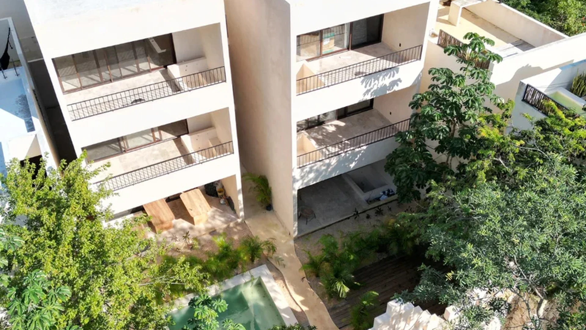 Image of Swimming Pool at Uxmal, featuring Modern Architecture, Residential Complex.