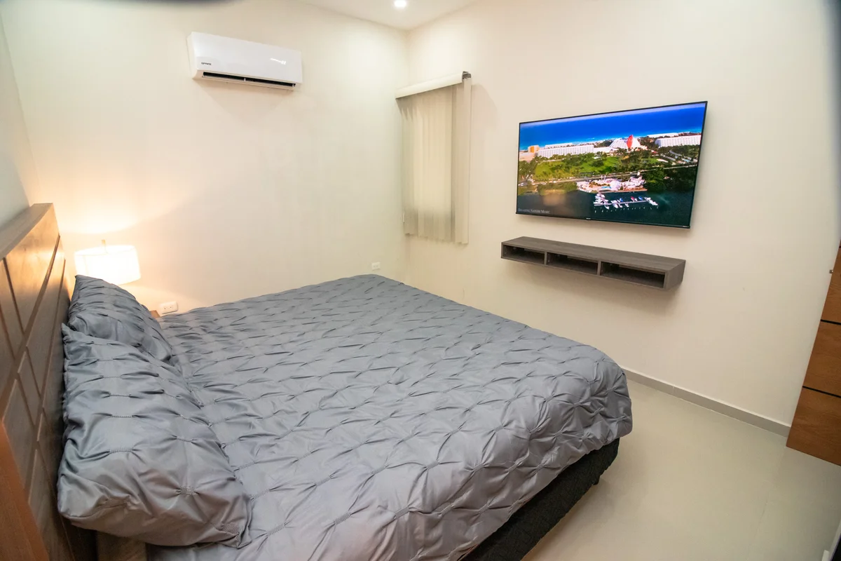 View of Bedroom at Torre 25, showcasing Modern Bedroom, Wall-mounted TV.