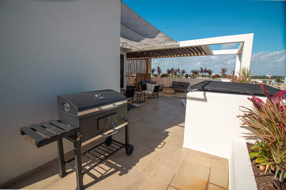 Image of Rooftop Terrace at Torre 25, featuring Rooftop Terrace, Outdoor Grill.