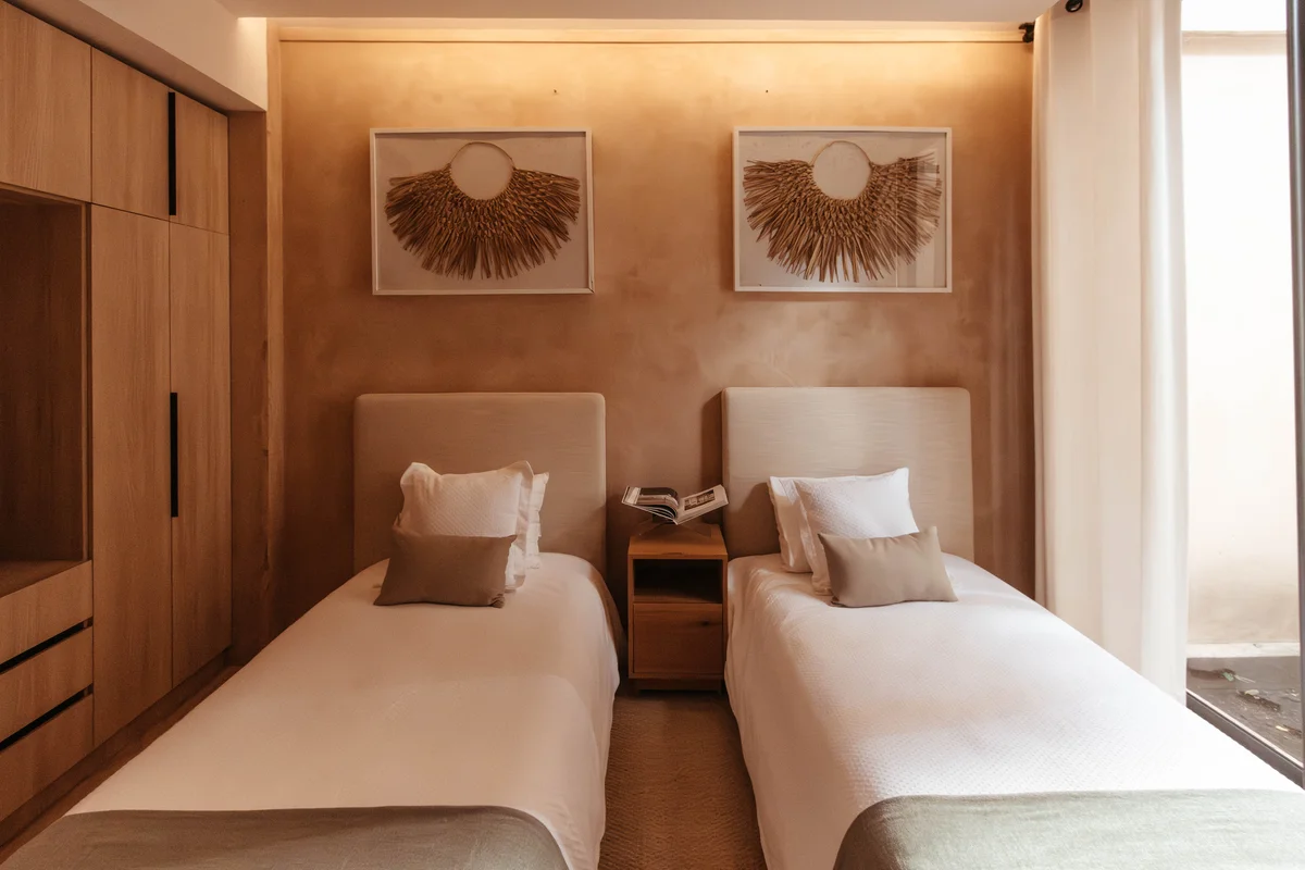 View of Bedroom at The Village, showcasing Twin Beds, Modern Bedroom.