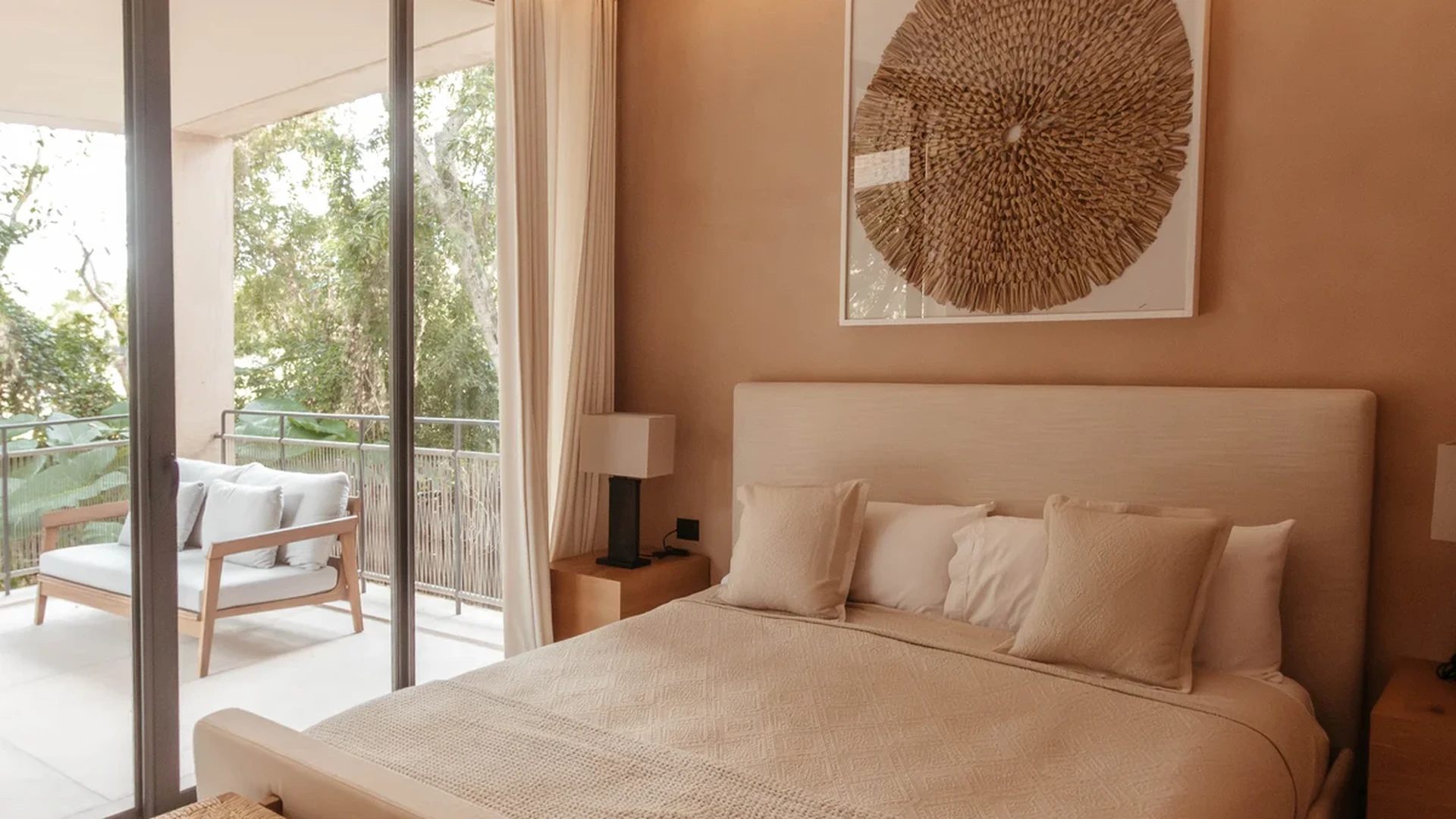 View of Modern Bedroom at The Village, showcasing Neutral Decor, Private Balcony.