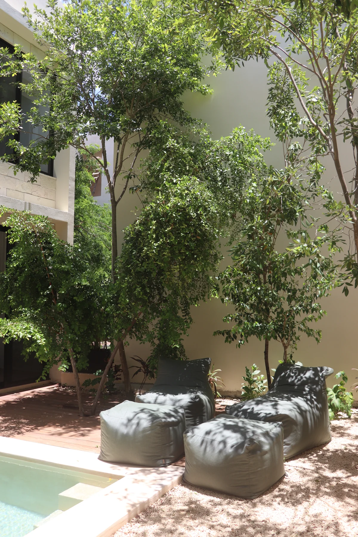 Image of Swimming Pool at Poc Ta Poc, featuring Outdoor Lounge Area, Lush Garden.