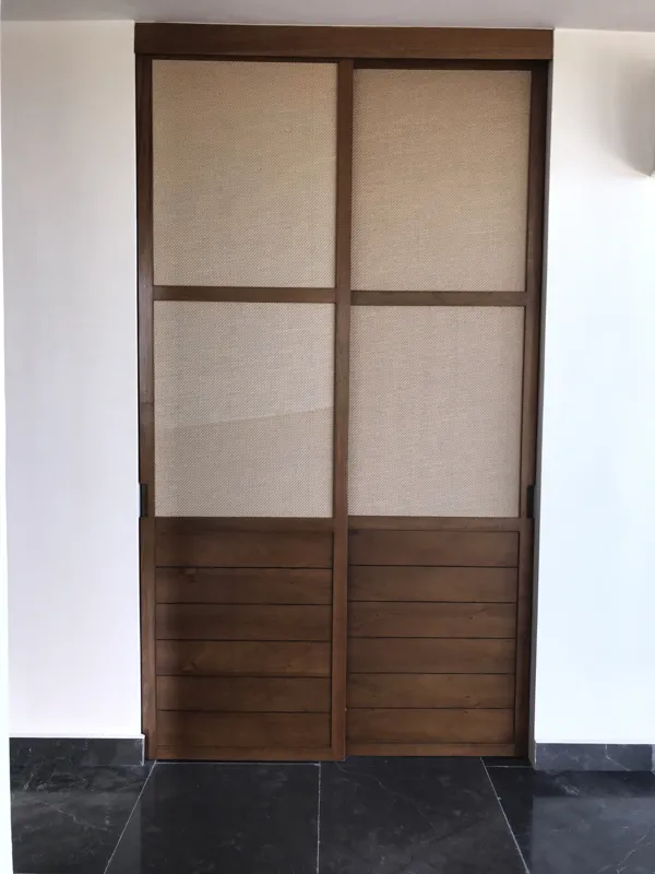 A collection of images showcasing the finished interiors of a Humana model unit, including a contemporary kitchen with dark cabinets and an island, a living area with dark marble floors and a built-in wooden daybed, and a bathroom with a unique st...