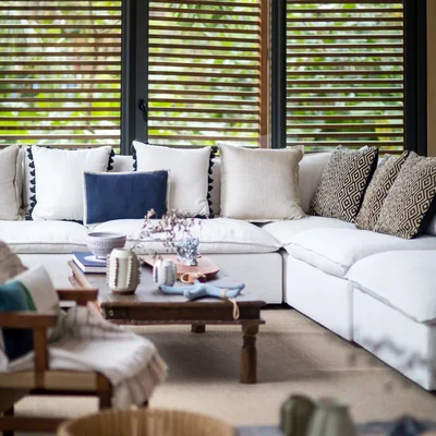 View of Living Room at Palm Villas, showcasing Sectional Sofa, Cozy Interior.