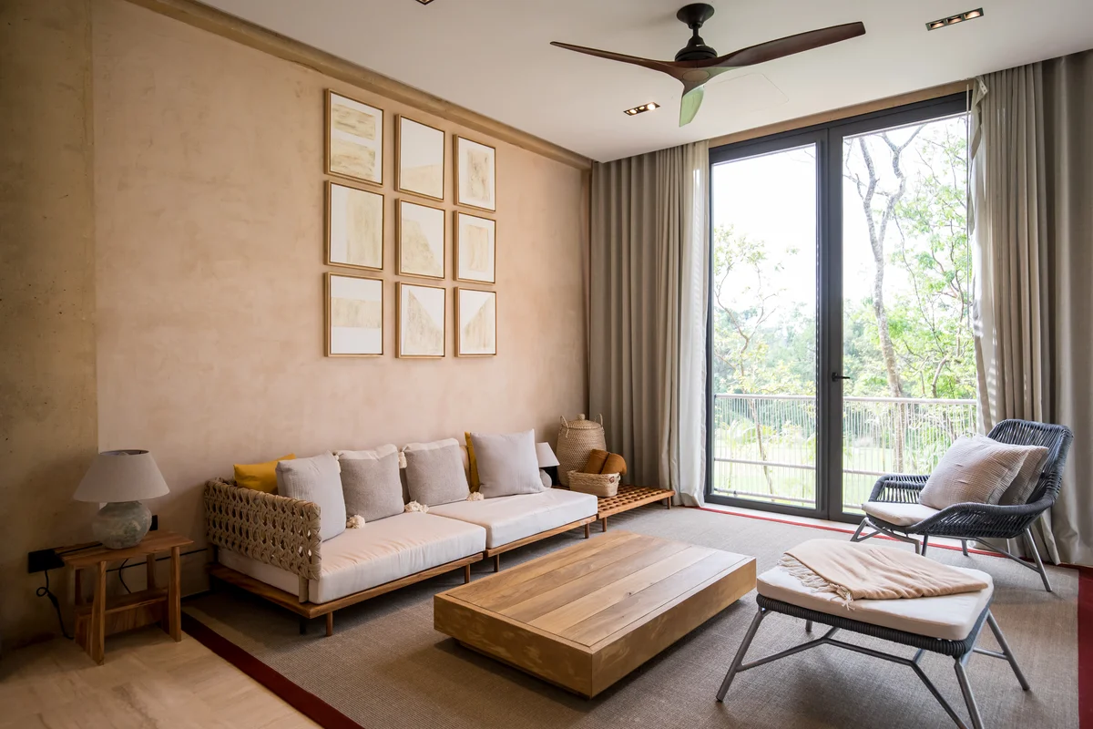 View of Modern Living Room at Palm Villas, showcasing Natural Light, Neutral Decor.