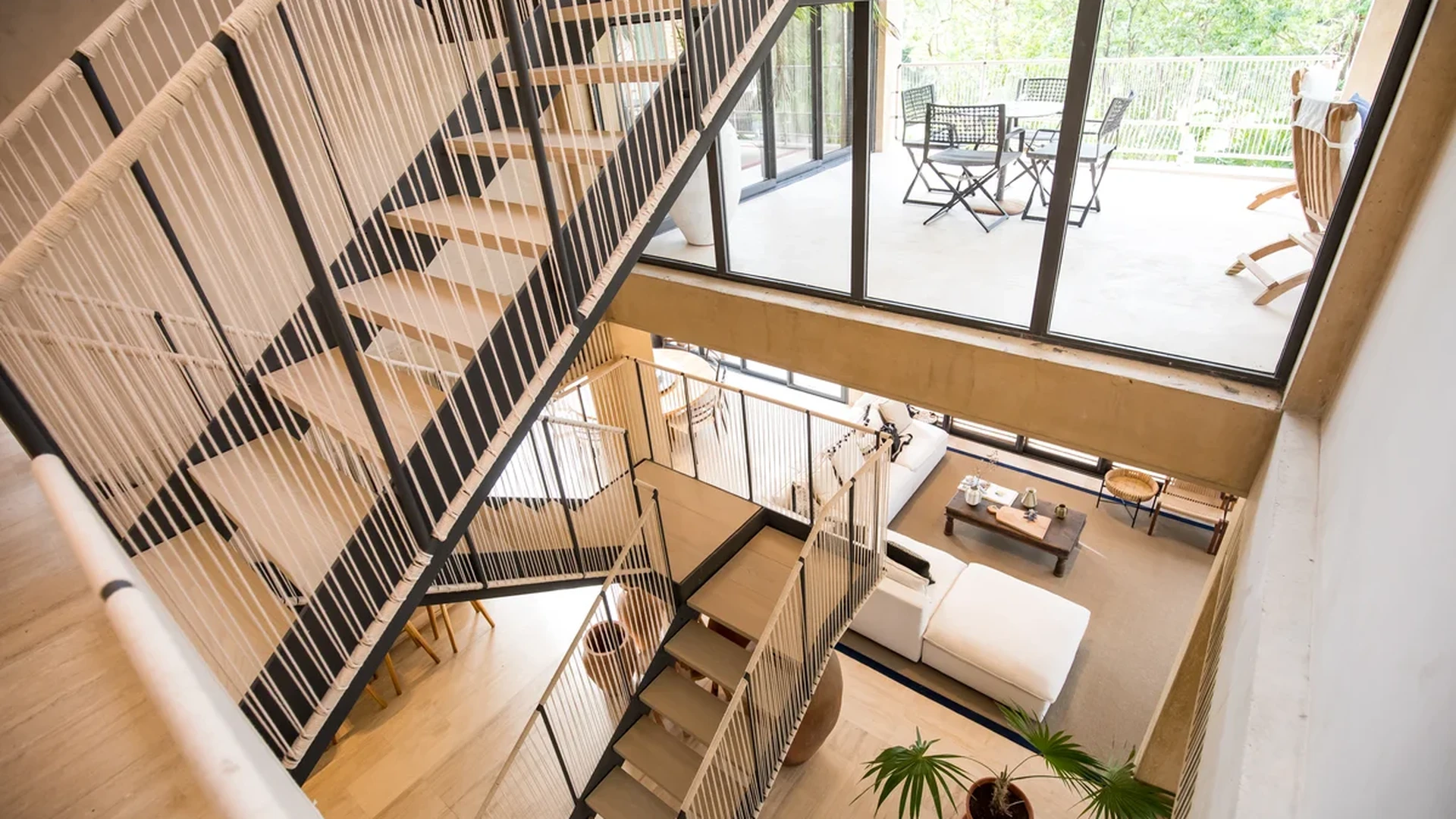 Image of Outdoor Terrace at Palm Villas, featuring Modern Interior, Multi-level Living.