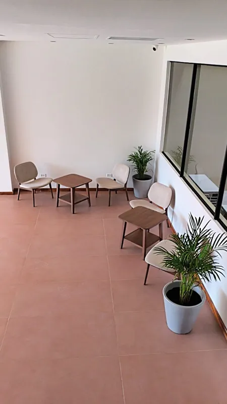 A collection of interior and exterior photographs showcasing the finished common areas and amenities of Quartier 75, including a stylish lobby lounge with contemporary furniture, a fully equipped modern gym with various exercise machines, a serene...