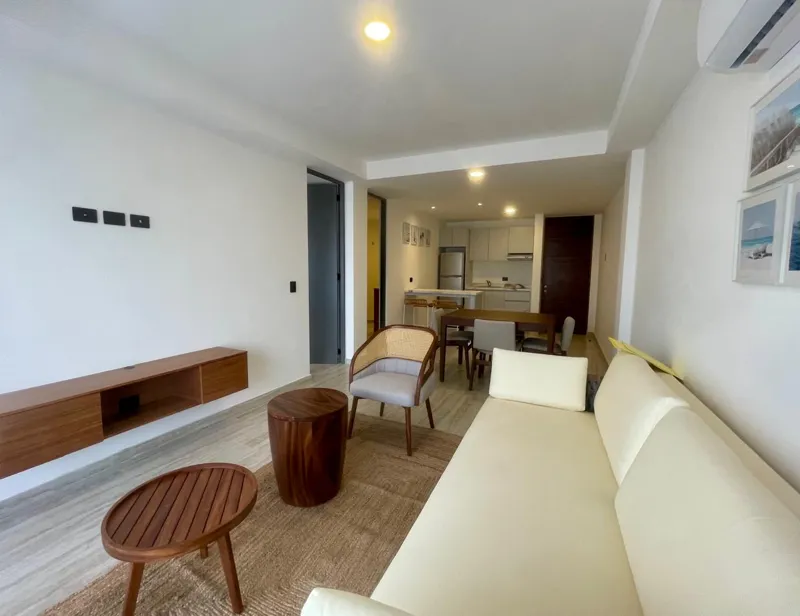 A collection of interior and exterior photographs showcasing the finished common areas and amenities of Quartier 75, including a stylish lobby lounge with contemporary furniture, a fully equipped modern gym with various exercise machines, a serene...