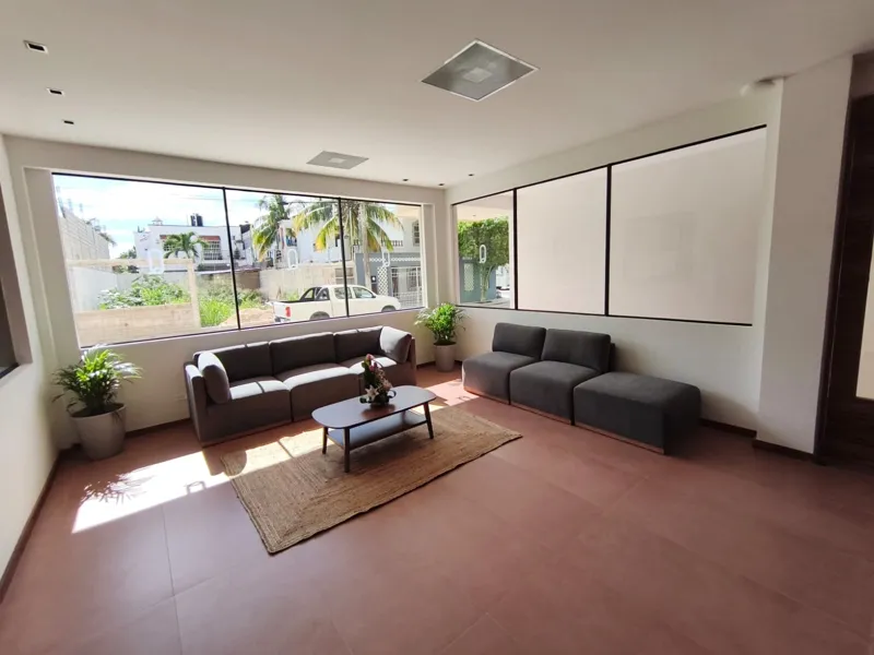 A collection of interior and exterior photographs showcasing the finished common areas and amenities of Quartier 75, including a stylish lobby lounge with contemporary furniture, a fully equipped modern gym with various exercise machines, a serene...