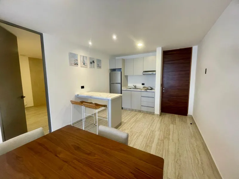 A collection of interior and exterior photographs showcasing the finished common areas and amenities of Quartier 75, including a stylish lobby lounge with contemporary furniture, a fully equipped modern gym with various exercise machines, a serene...