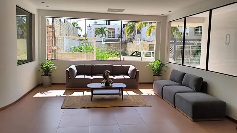 A collection of interior and exterior photographs showcasing the finished common areas and amenities of Quartier 75, including a stylish lobby lounge with contemporary furniture, a fully equipped modern gym with various exercise machines, a serene...