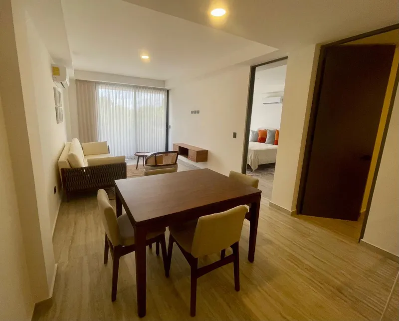 A collection of interior and exterior photographs showcasing the finished common areas and amenities of Quartier 75, including a stylish lobby lounge with contemporary furniture, a fully equipped modern gym with various exercise machines, a serene...