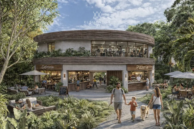 Architectural render of Elementos Life's central amenity building, featuring a ground-floor cafeteria and pizzeria with outdoor seating areas, and an upper-floor fitness center with large windows. The building is surrounded by dense tropical folia...