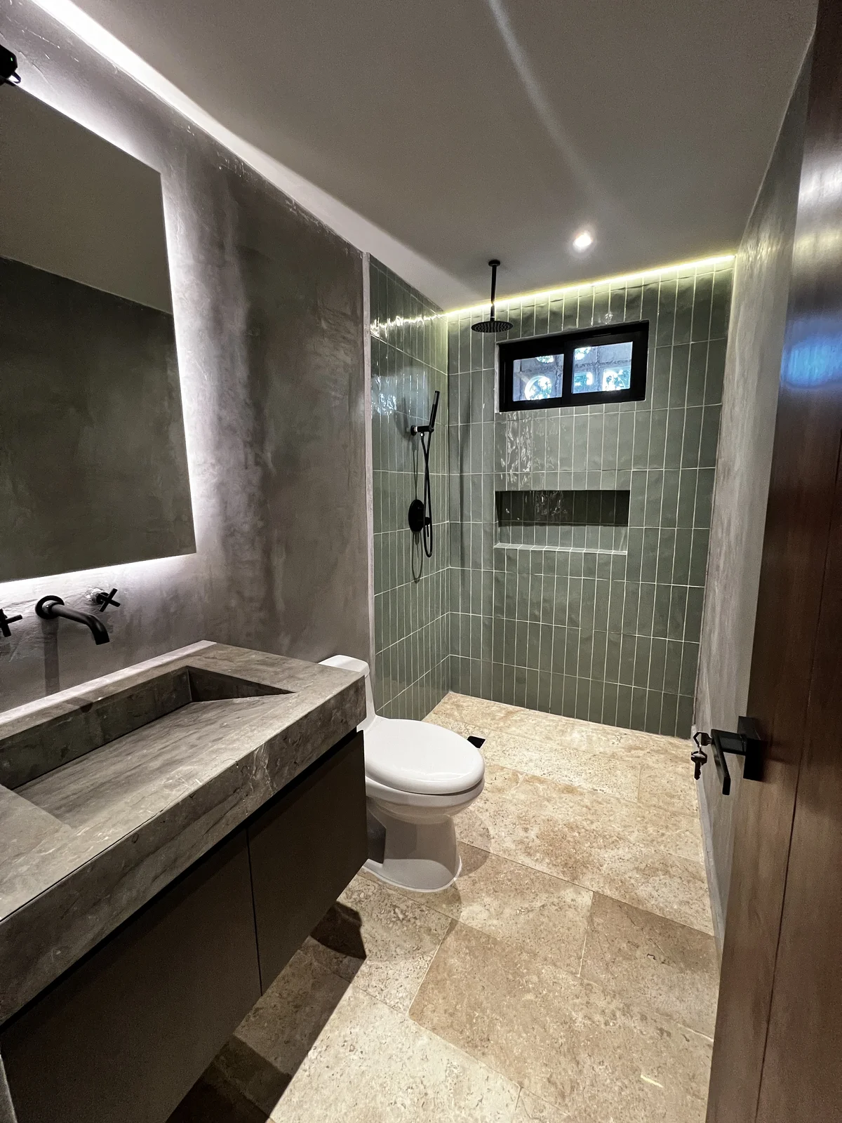View of Modern Bathroom at Punta Playa, showcasing Stone Vanity, Walk-in Shower.