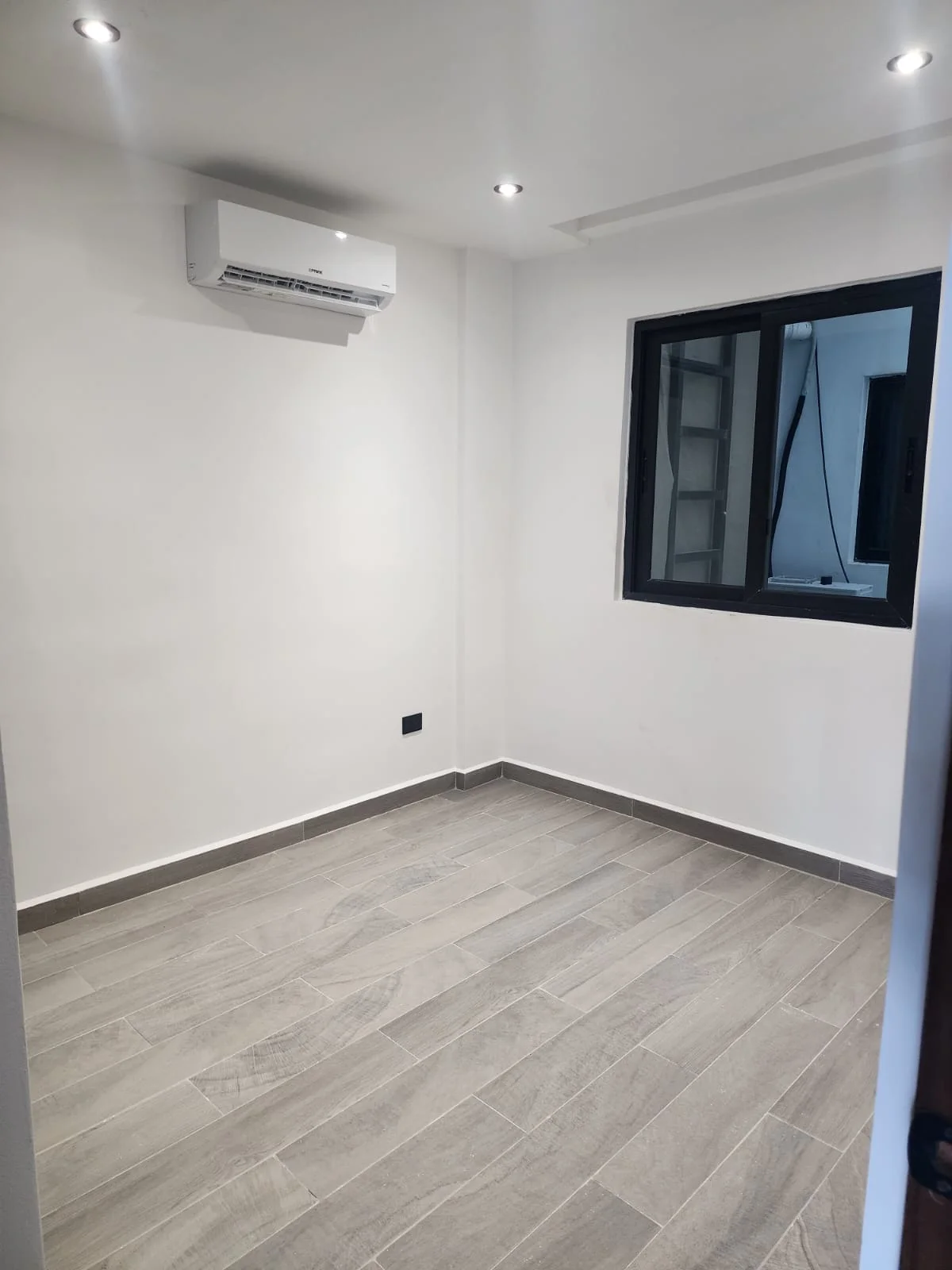 View of Unfurnished Room at Serenata, showcasing Modern Interior, Empty Space.