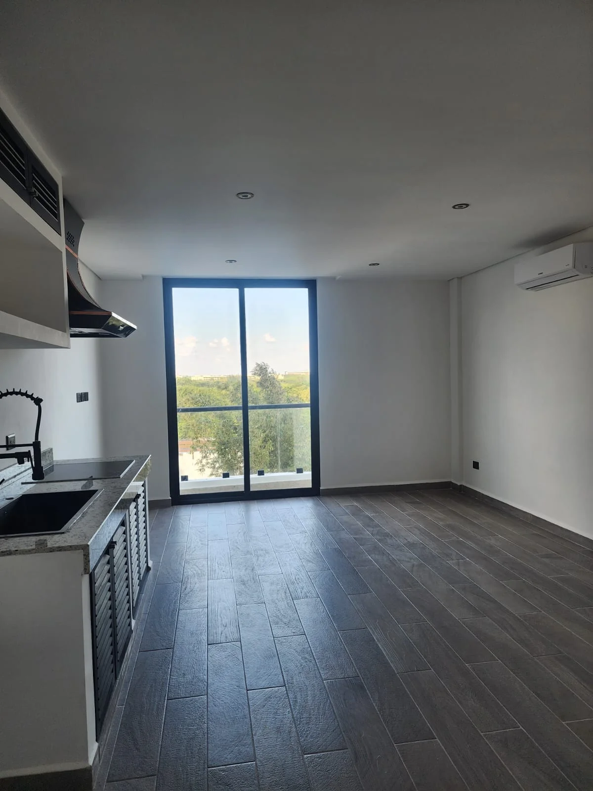 View of Modern Kitchen at Serenata, showcasing Open Concept Living, Unfurnished Apartment.