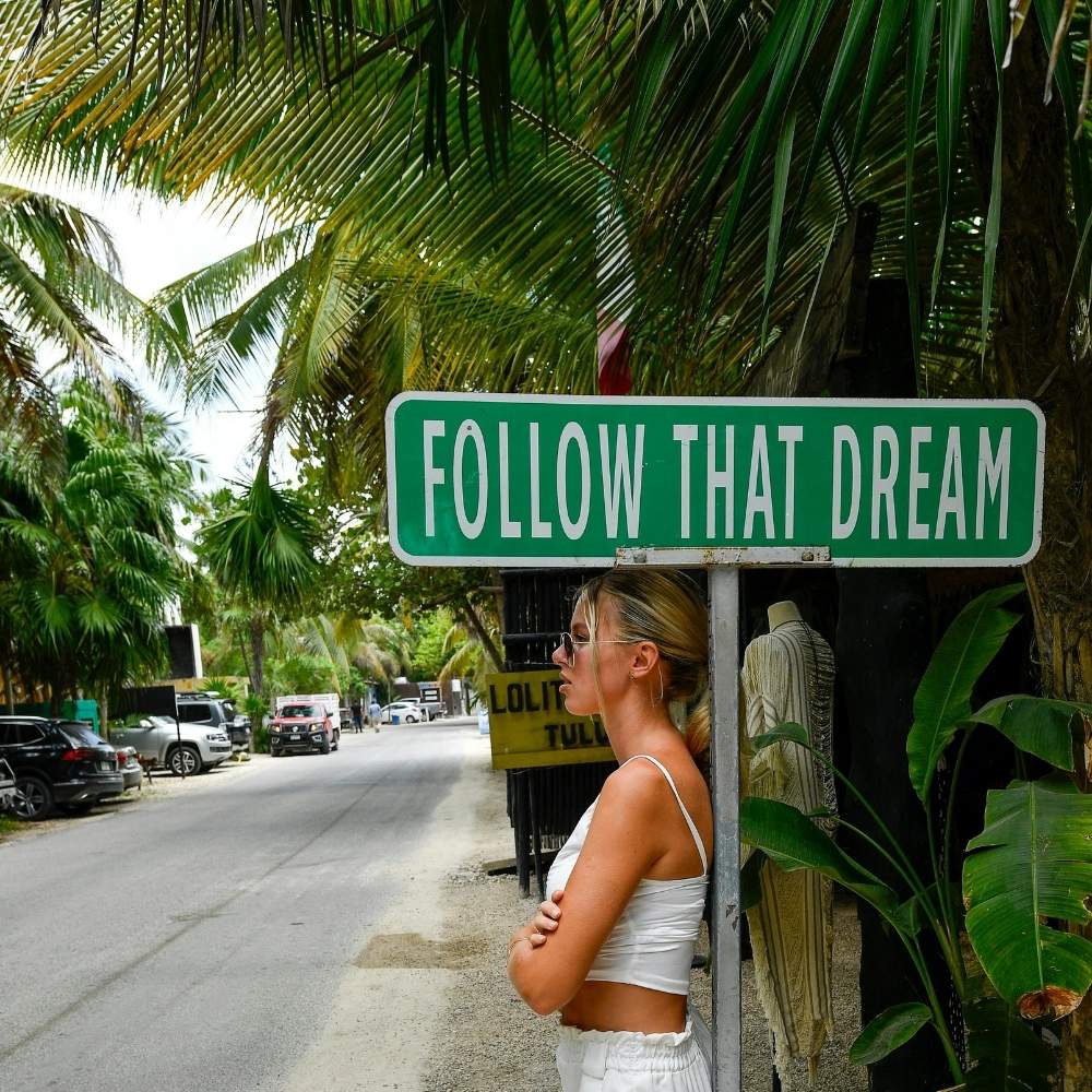 tulum-girl beneath follow that dream sign
