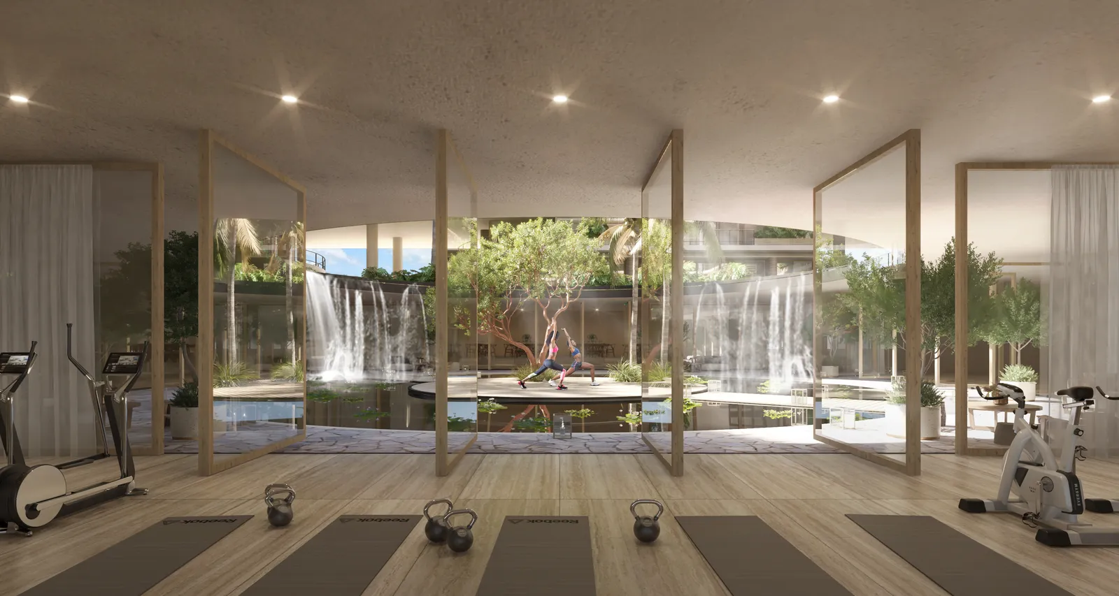 Modern gym interior with yoga mats and outdoor waterfall view