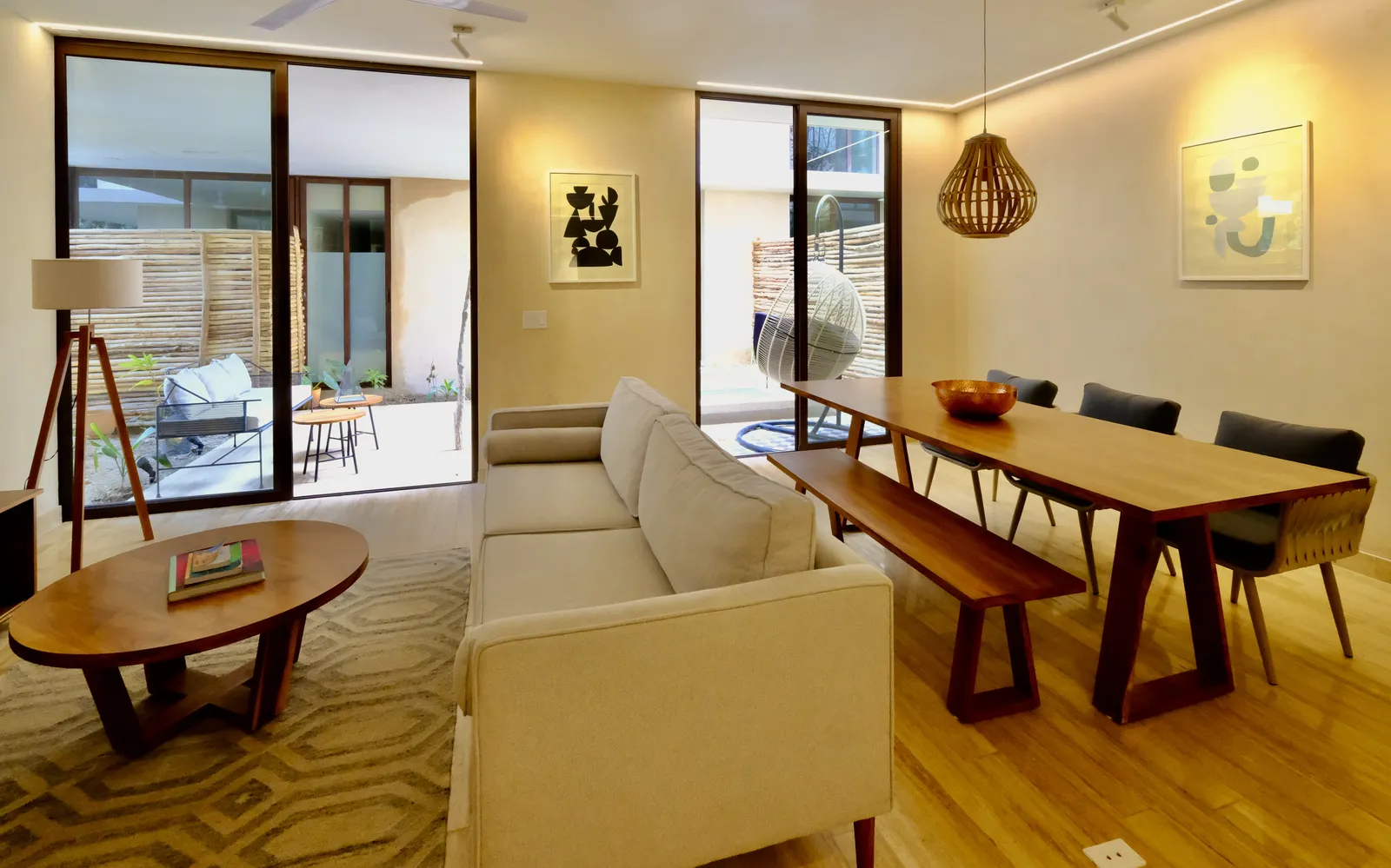Furnished living and dining area with wooden furniture