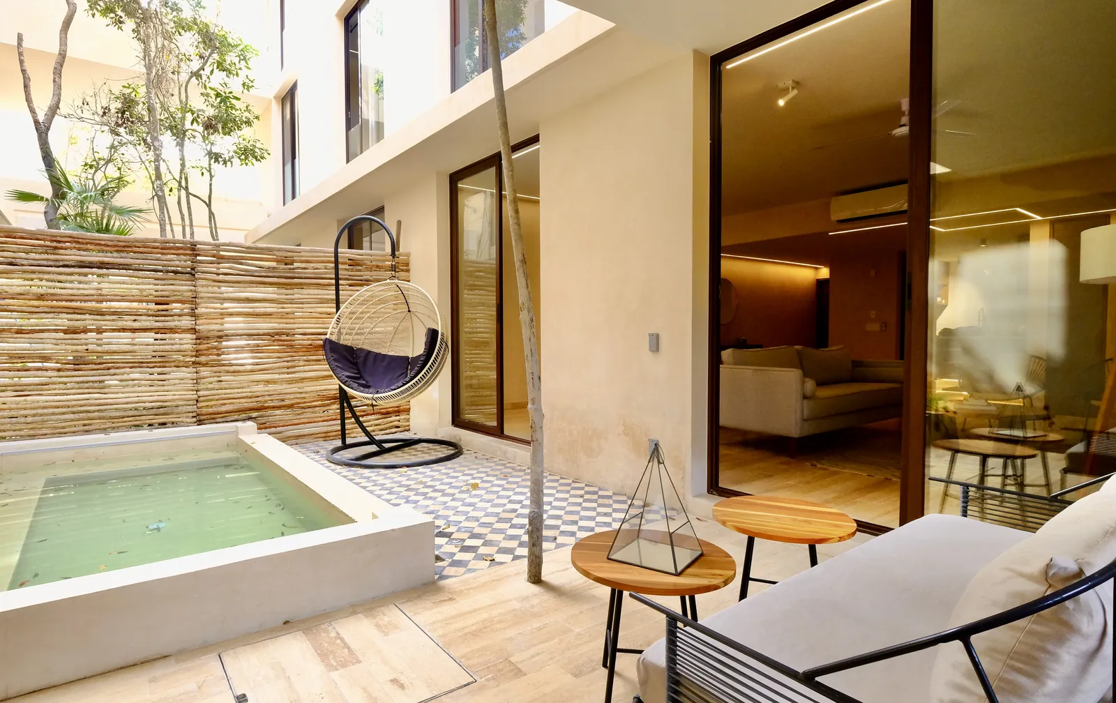 Outdoor patio with plunge pool and hanging chair
