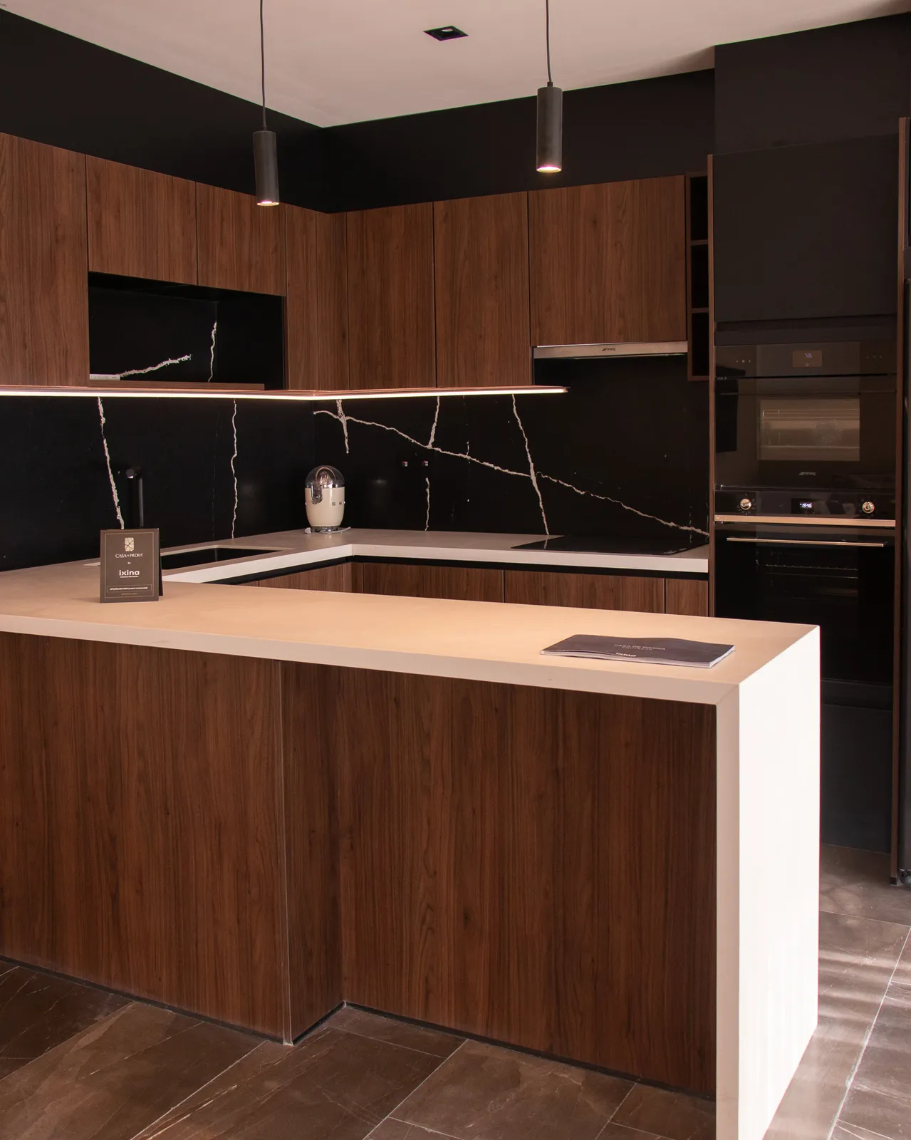 Modern kitchen with wooden cabinets and black marble backsplash